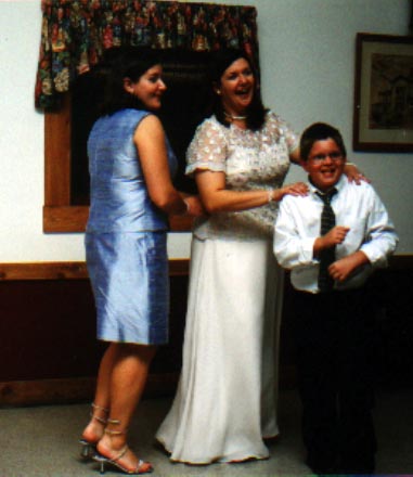 Dancing Man Tyler leads Bethany and Rosemary in a conga line